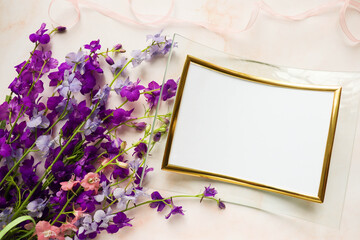 greeting card mockup. bouquet of violet flowers and space for text. congratulation. invitation