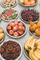 Trays of engagement gifts; apples, banana, grapes, coconut, mango, sweets and traditional cookies.