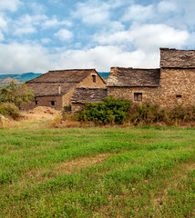 Village with stone houses in the Pyrenees mountains in a cloudy day