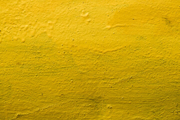 Yellow background. Texture. Metal painted in yellow.