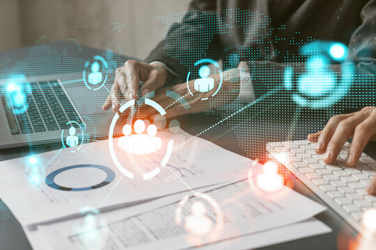 Multi exposure of two people work together background and human icon network hologram. Concept of social media.