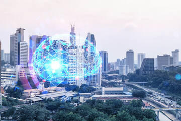 Brain hologram over panorama city view of Kuala Lumpur. KL is the largest science hub in Malaysia,...