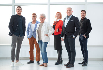 Group of business people in an office lined up