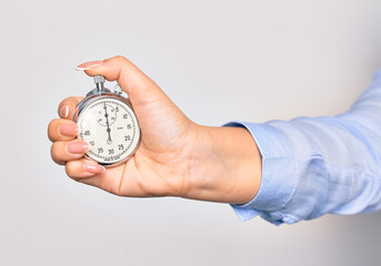 Hand of caucasian young woman counting time using stopwatch over isolated white background