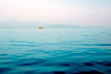 Small desert island in the sea