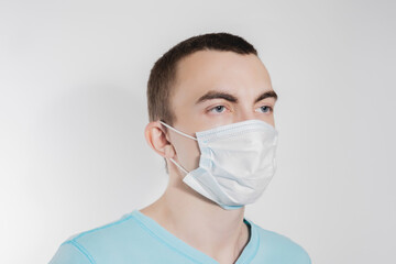 a man in a medical mask from kovid19 blue on a white background