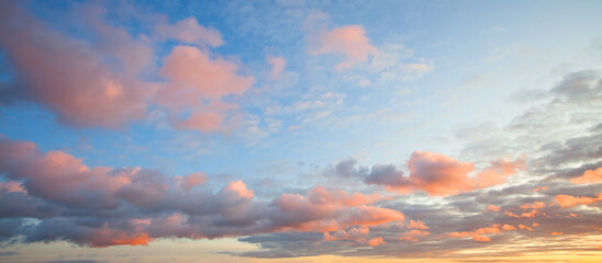 Sunset sky clouds background. Beautiful landscape with clouds and orange sun on sky