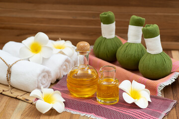Spa composition on wooden table, traditional Thai herbal massage, wellness center concept