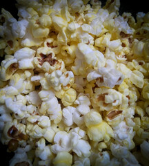 close up of popcorn on white background