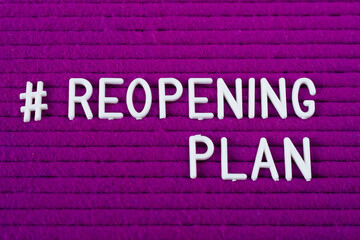 #Reopening plan text on purple letter board. Business concept. Service, restaurant, shop and cafe re-opening. Reopening of the place after the quarantine due to covid-19. Message. New rules we're open