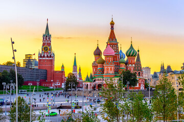 Fototapeta premium Spasskaya Tower, Moscow Kremlin and Saint Basil s Cathedral in Moscow, Russia. Architecture and landmarks of Moscow. Postcard of Moscow