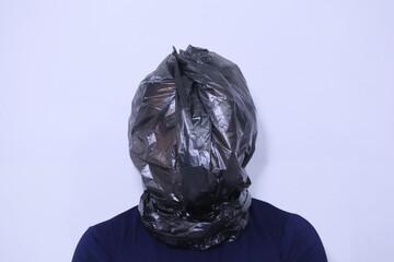 black plastic bag wraps around a human head