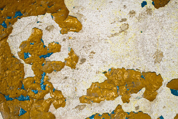 old plaster with flaky yellow