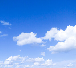 Beautiful white fluffy clouds in the blue sky.The sky is blue with clouds, beautiful by nature.
