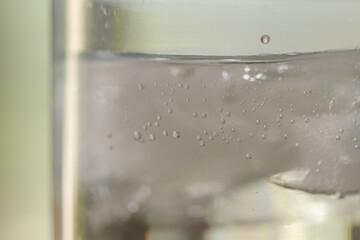 
bubbles in a glass with cold sparkling water