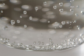 
bubbles in a glass with cold sparkling water