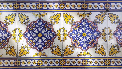 Traditional portuguese azulejo tiles with blue, yellow and white decoration