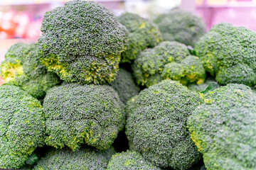 The view of supermarket stall full of fresh green cauliflower vegetables