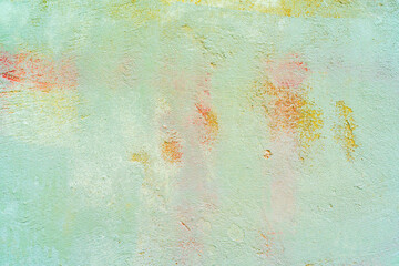 Light green stucco. Rough wall of an old house. Abstract building background.