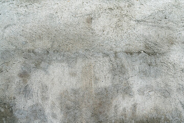 Grungy gray wall of an old house. Abstract gray background.