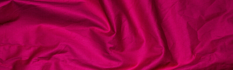 crinkled red material texture or background.