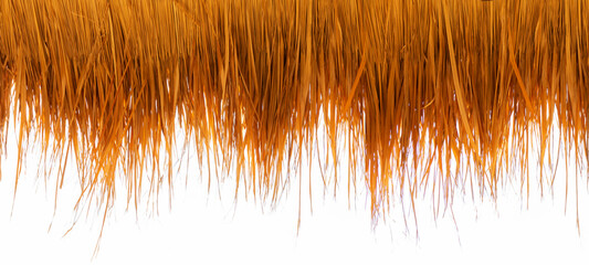 Roof made from dry grass on white background of the bar on the beach during the holiday season.