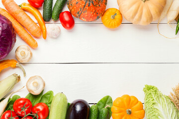 Fresh garden vegetarian food. Autumn seasonal image of farmer table with mushrooms, cucumbers,...