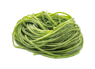 Fresh organic raw spaghetti pasta with spinach isolated on white background