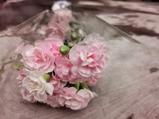 pink flower bouquet on wood table
