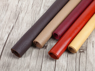 Rolled up multicolored natural leather textures samples