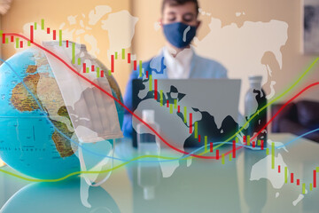 Earth with a face mask and Business man on a desk working with a mask on the background working on a computer. And trading and finance charts on the top with a transparent map