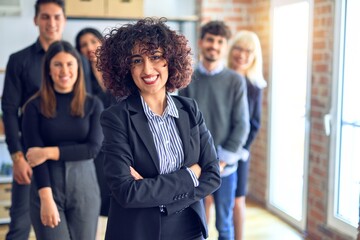 Group of business workers smiling happy and confident. Posing together with smile on face looking...