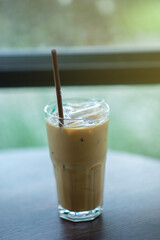 Iced coffee resting on the table background blurred
