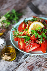 Selective focus. Salad with tomatoes and micro-greens. Salad with radish and feta cheese. Healthy diet. Vegan food.