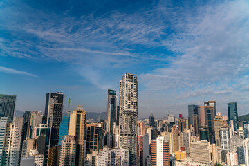 Fototapeta na wymiar The amazing view of Hong-Kong cityscape full of skyscrapers from the rooftop.