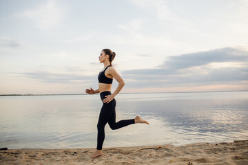 Fototapeta na wymiar Healthy woman running on the beach, girl doing sport outdoor, fitness and heath care concept with copy space over natural background