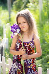 Girl with an iris flower
