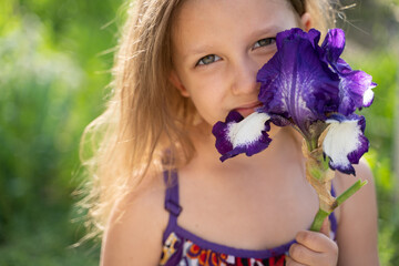 Girl with an iris flower