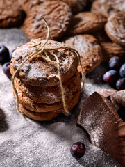 Bakers gonna bake. Serving food on slate. Oatmeal cookies biscuit with blueberry on dark tiles countrylike. Chocolate chip cookies tied with string shop on window display. Dessert in cafe.