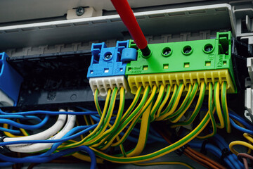 Worker connecting some ground wires, pad grounding