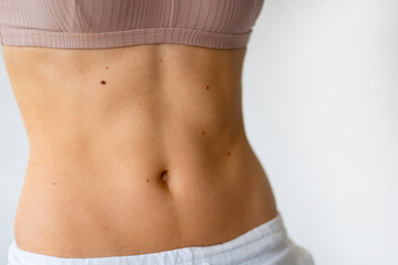 Fototapeta na wymiar exercise for stomach vacuum. fitness for a beautiful press. 