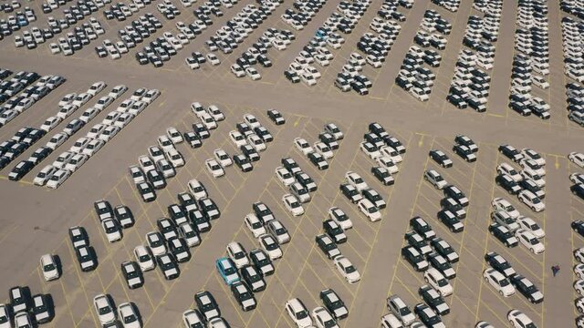 Aerial view of huge storage parking with new cars