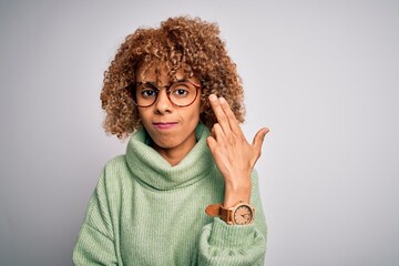 Young beautiful african american woman wearing turtleneck sweater and glasses Shooting and killing oneself pointing hand and fingers to head like gun, suicide gesture.