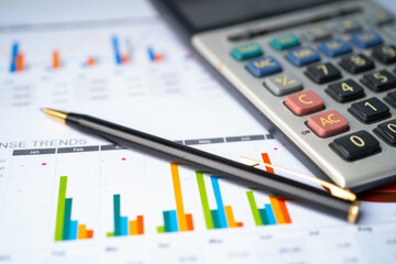 Calculator on chart and graph spreadsheet paper. Finance development, Banking Account, Statistics, Investment Analytic research data economy, Stock exchange trading, Business company concept.