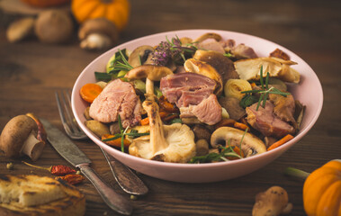 Homemade fried mushrooms, pork and vegetables in the plate