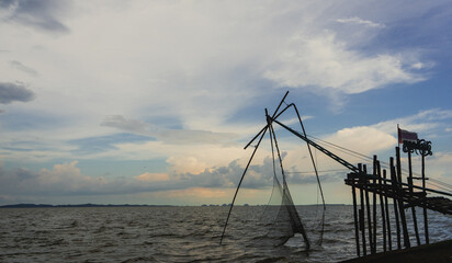 Silhouette of the big square dip net in Thailand with beautiful sky