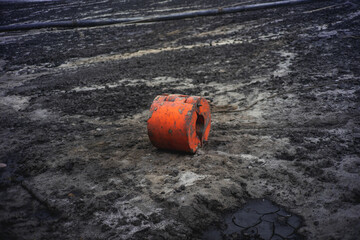 Old buoy on the muddy beach in South of Thailand