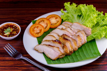 Grilled pork salad on wooden table