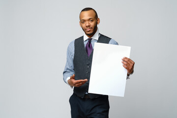 professional african-american business man - presenting holding blank sign