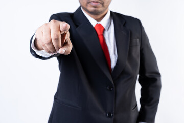 Closed up shot of an asian men pointing at the camera wearing a suit